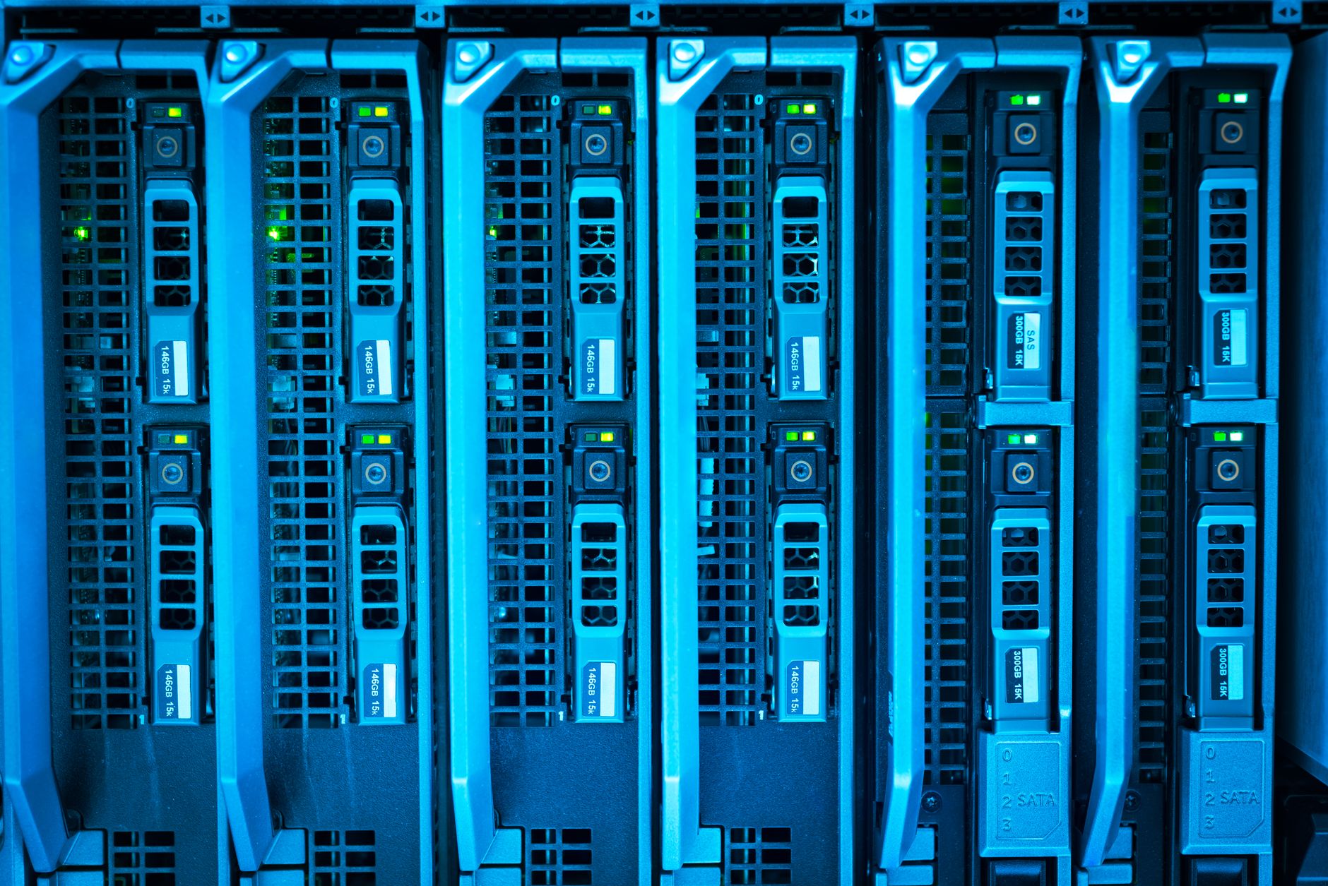 Rows of servers in a data centre with their indicator lights on